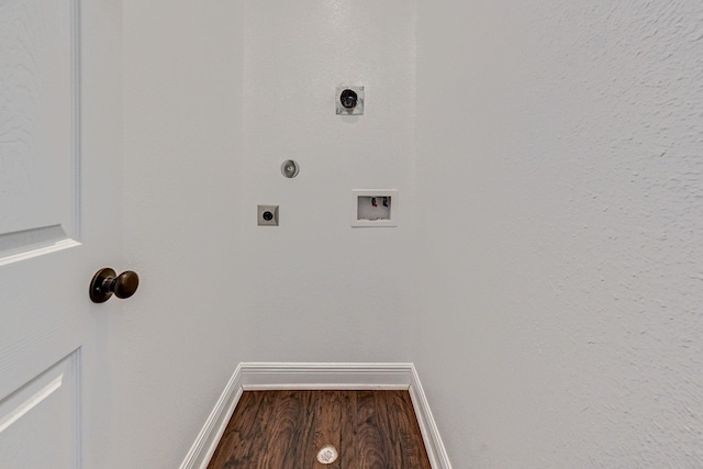 laundry area with electric dryer hookup, hookup for a washing machine, and wood-type flooring