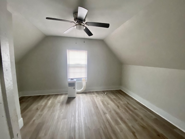 bonus room with ceiling fan, wood-type flooring, and vaulted ceiling