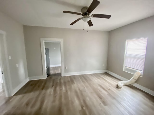 spare room featuring light wood-type flooring and ceiling fan