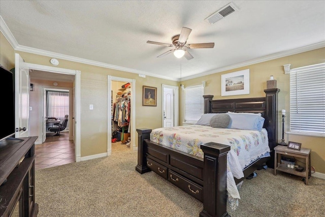 319 Dixie Dr, Bridge City, TX 77611 - bedroom featuring a spacious closet, light carpet, baseboards, crown molding, and a closet
