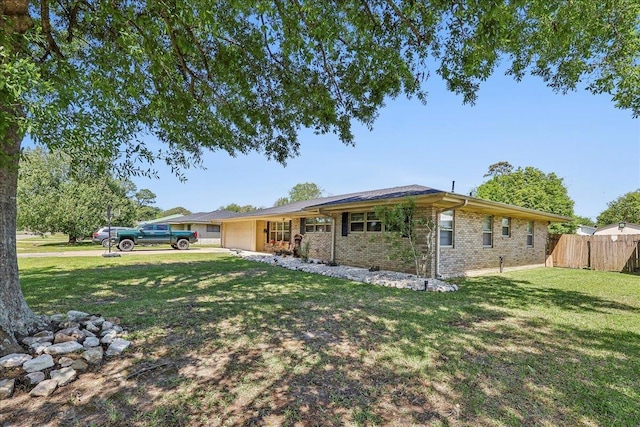 319 Dixie Dr, Bridge City, TX 77611 - view of front of house with an attached garage and brick siding