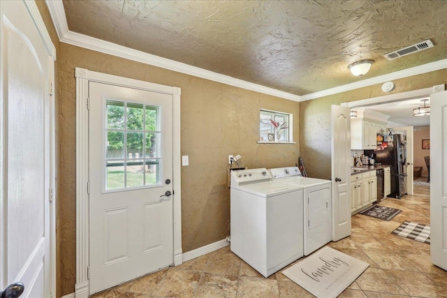 319 Dixie Dr, Bridge City, TX 77611 - washroom with independent washer and dryer, healthy amount of natural light, ornamental molding, baseboards, and a textured wall