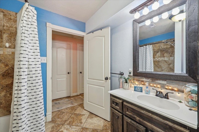 319 Dixie Dr, Bridge City, TX 77611 - full bath with vanity and stone finish flooring