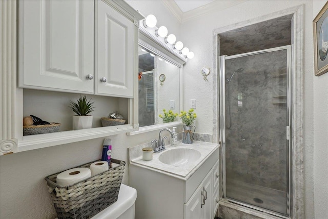 319 Dixie Dr, Bridge City, TX 77611 - full bathroom with vanity, a stall shower, crown molding, toilet, and a textured wall