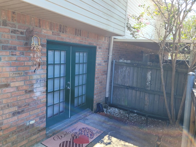 view of exterior entry featuring french doors