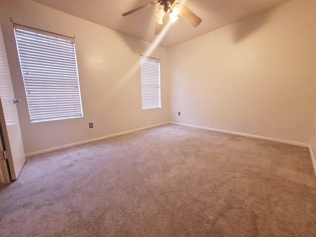 carpeted empty room with ceiling fan