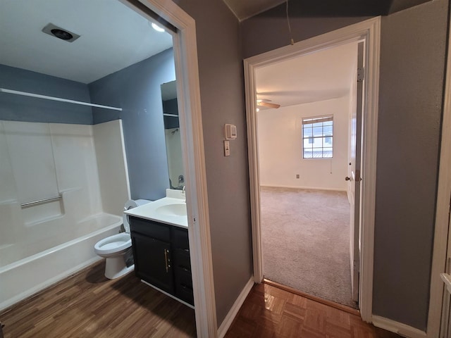 full bathroom with bathing tub / shower combination, vanity, and toilet