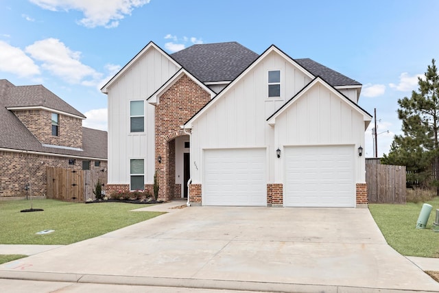 view of front facade featuring a garage and a front yard