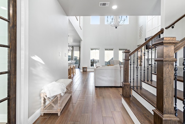 entryway with a chandelier and a high ceiling