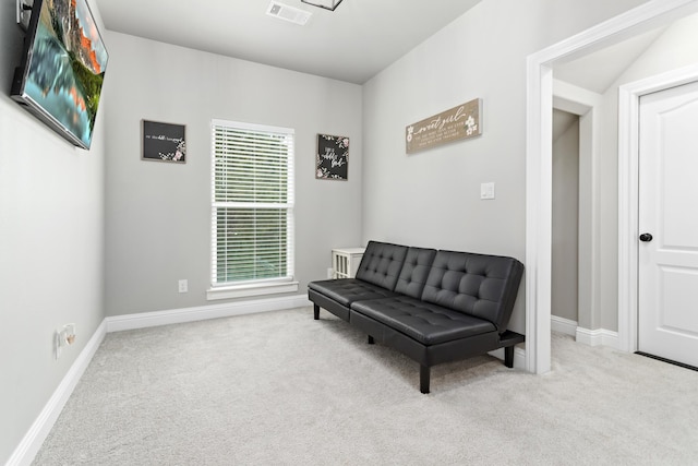 living area with light carpet