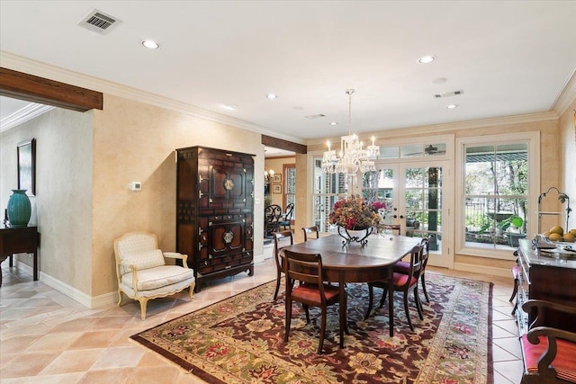 dining area with french doors, an inviting chandelier, and crown molding