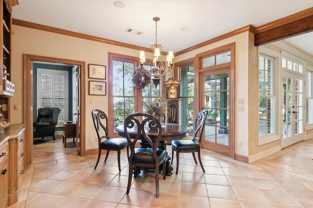 tiled dining room with crown molding, french doors, and a chandelier