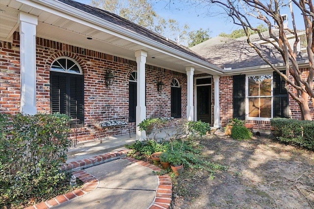 entrance to property featuring a porch