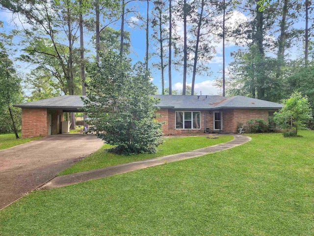 single story home with an attached carport, concrete driveway, brick siding, and a front yard
