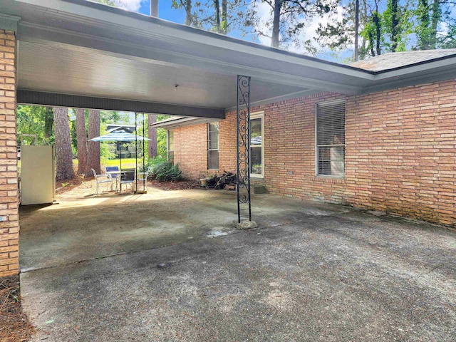 view of patio / terrace featuring an attached carport