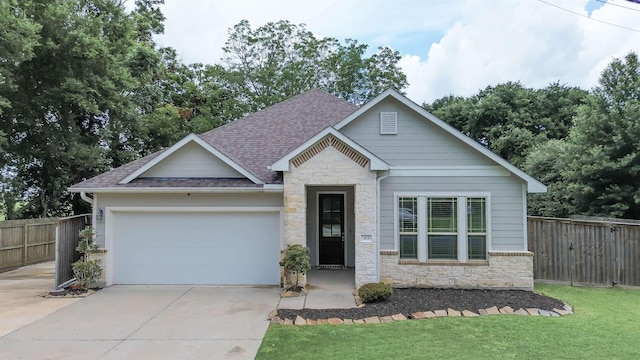 craftsman inspired home with a front yard and a garage