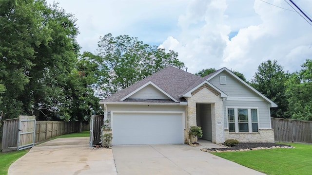 craftsman-style house with a garage and a front yard