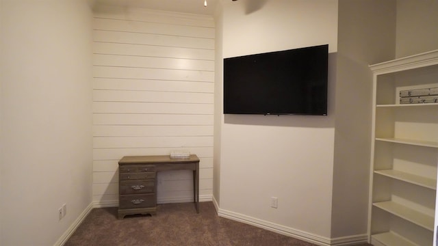 unfurnished bedroom featuring dark carpet