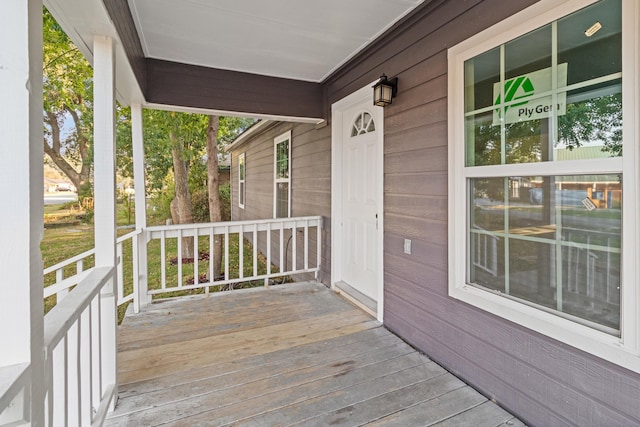 wooden terrace with a porch