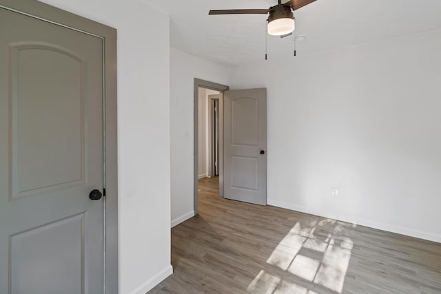 interior space with ceiling fan and light hardwood / wood-style flooring