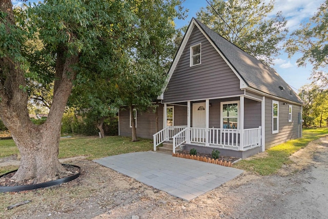 bungalow-style house featuring a front yard and a porch