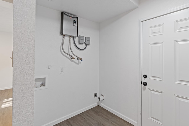 washroom with hookup for an electric dryer, dark hardwood / wood-style flooring, gas dryer hookup, and hookup for a washing machine