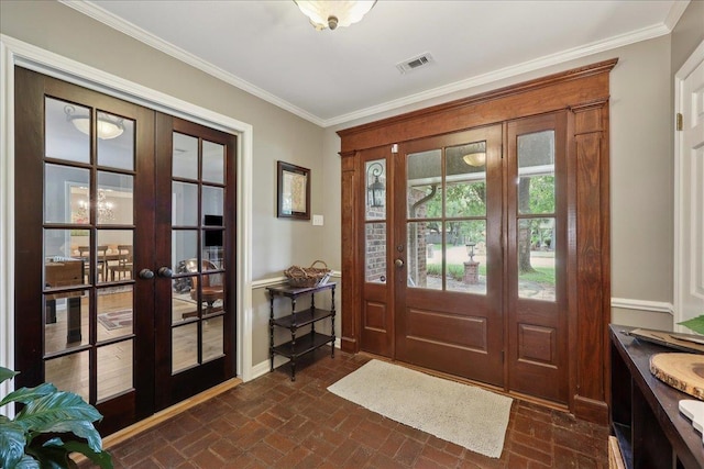 1550 Belvedere Dr, Beaumont, TX 77706 - foyer featuring french doors, brick floors, baseboards, and ornamental molding