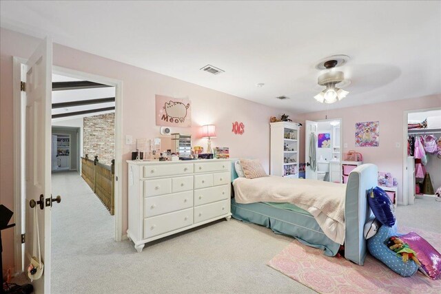 1550 Belvedere Dr, Beaumont, TX 77706 - bedroom with light carpet, a spacious closet, a ceiling fan, and a closet