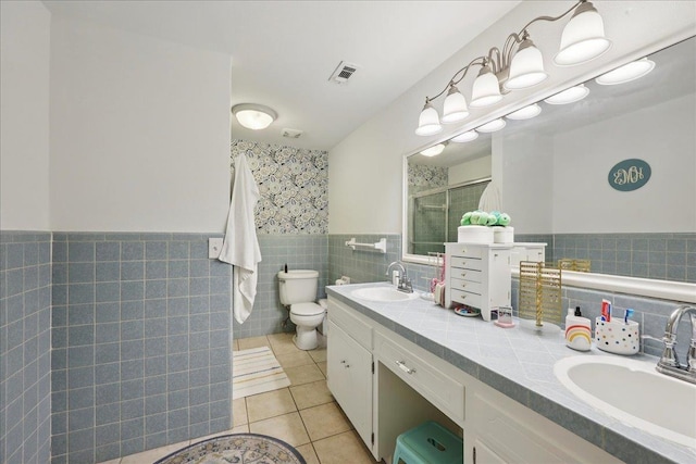 1550 Belvedere Dr, Beaumont, TX 77706 - full bath with tile walls, tile patterned flooring, a stall shower, toilet, and double vanity