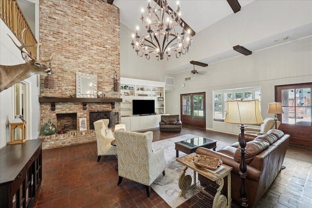 1550 Belvedere Dr, Beaumont, TX 77706 - living room featuring high vaulted ceiling, a brick fireplace, a chandelier, brick flooring, and built in shelves