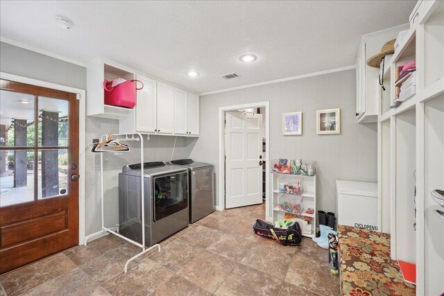 1550 Belvedere Dr, Beaumont, TX 77706 - laundry room with cabinet space, washer and dryer, ornamental molding, recessed lighting, and baseboards