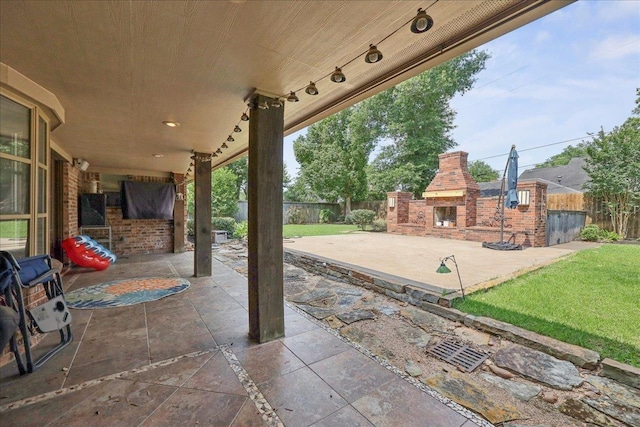 1550 Belvedere Dr, Beaumont, TX 77706 - view of patio / terrace featuring exterior fireplace