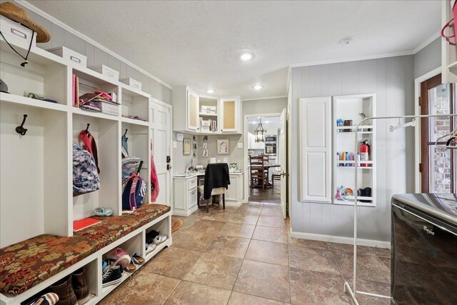 1550 Belvedere Dr, Beaumont, TX 77706 - mudroom with ornamental molding, built in study area, a textured ceiling, and baseboards