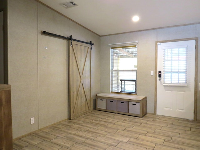 14547 Oak Leaf Loop, Splendora, TX 77372 - foyer entrance featuring a barn door and wood finish floors