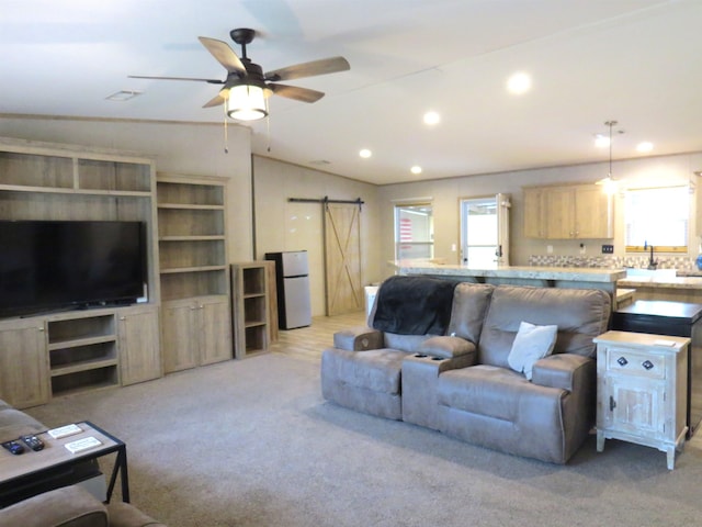14547 Oak Leaf Loop, Splendora, TX 77372 - living room with a barn door, healthy amount of natural light, vaulted ceiling, recessed lighting, and ceiling fan