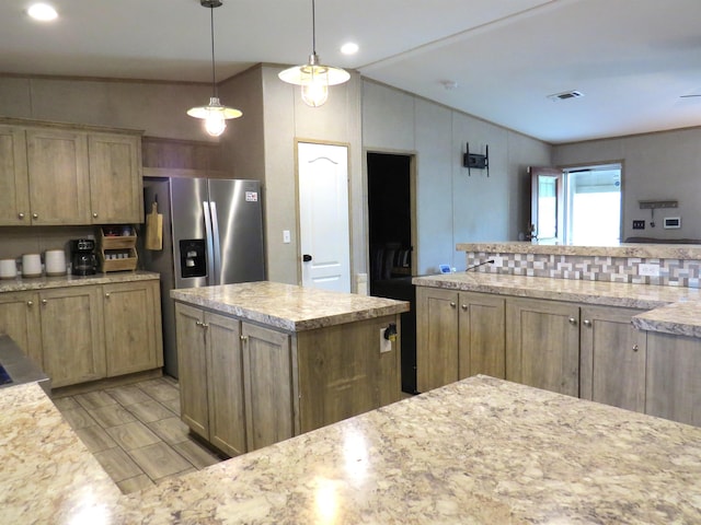 14547 Oak Leaf Loop, Splendora, TX 77372 - kitchen featuring stainless steel fridge, decorative light fixtures, recessed lighting, vaulted ceiling, and a center island