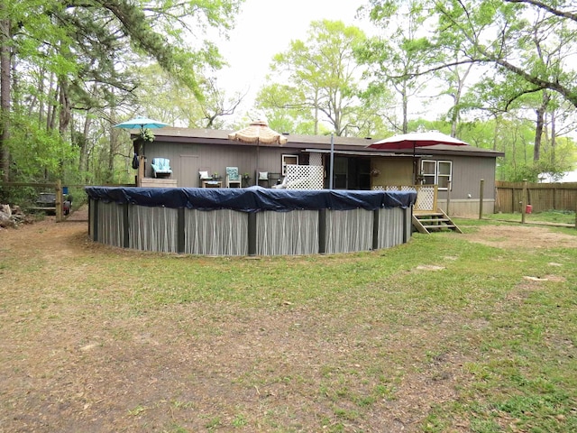 14547 Oak Leaf Loop, Splendora, TX 77372 - rear view of house with a covered pool