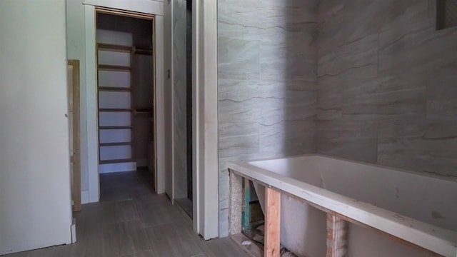 hall with tile walls