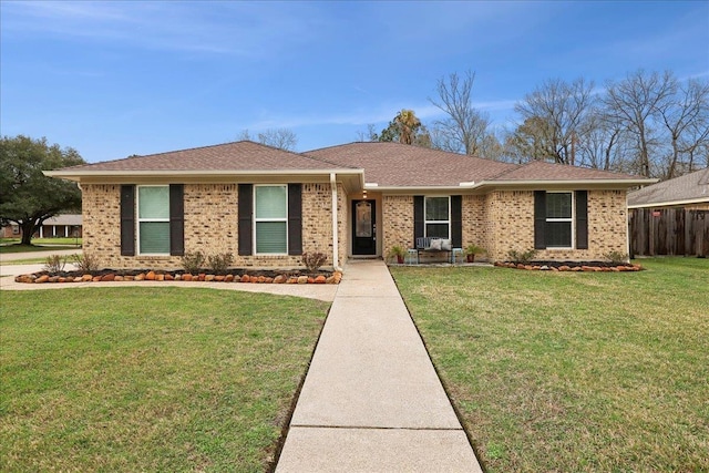 ranch-style home with a front yard