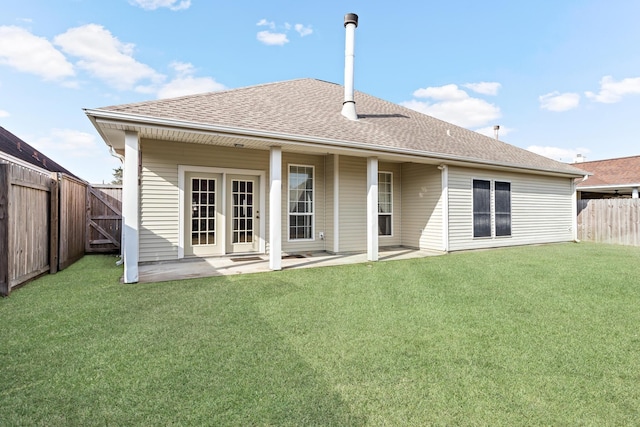 back of property featuring a lawn and a patio