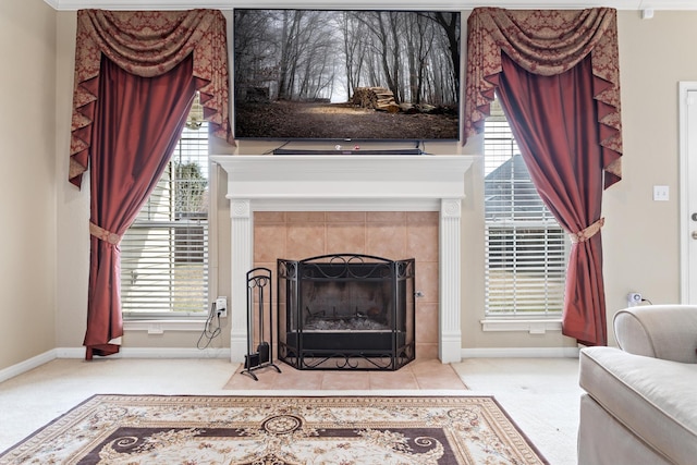 living room with light carpet, a tile fireplace, and a healthy amount of sunlight