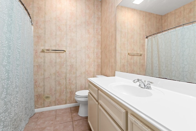 bathroom with vanity, toilet, and tile patterned flooring