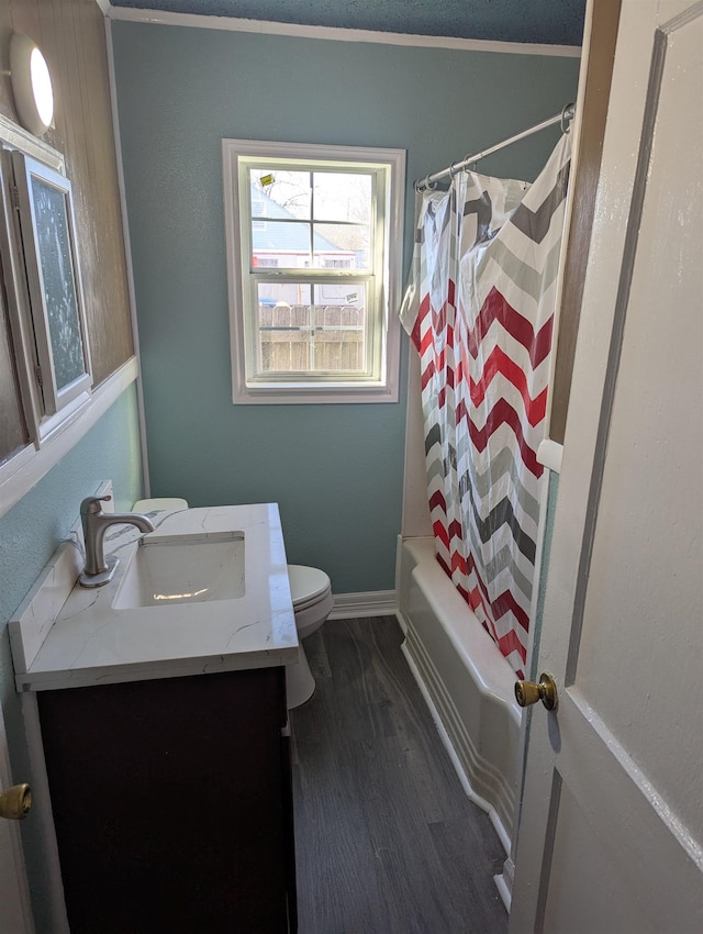 full bathroom featuring vanity, wood-type flooring, shower / tub combo with curtain, and toilet