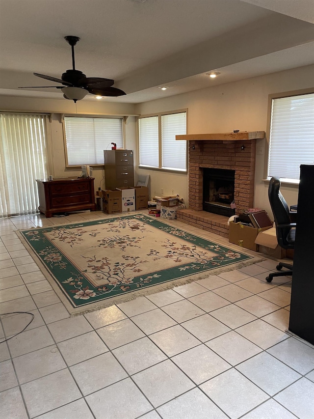 living room with tile patterned flooring, a brick fireplace, recessed lighting, and ceiling fan