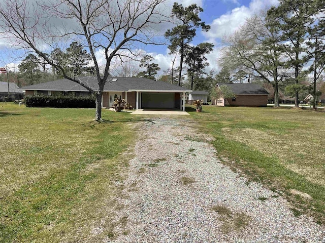 exterior space featuring a front yard and driveway