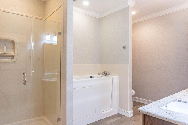 full bathroom with hardwood / wood-style floors, vanity, toilet, and independent shower and bath