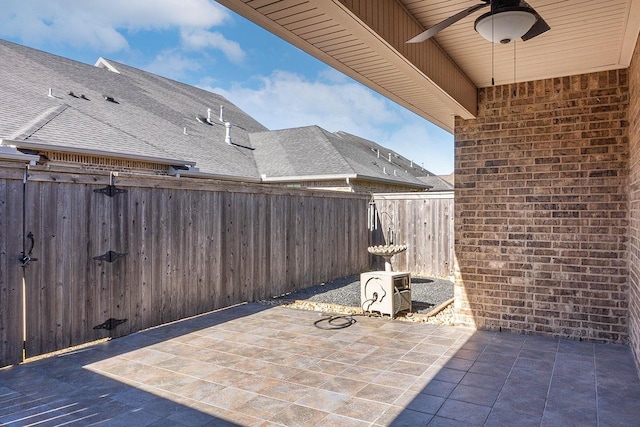 view of patio featuring ac unit and ceiling fan