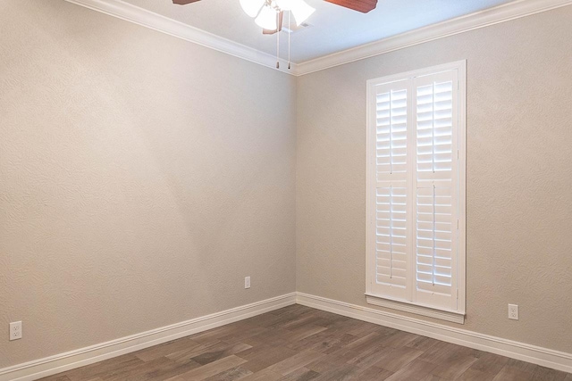 spare room with ceiling fan, dark hardwood / wood-style flooring, and ornamental molding