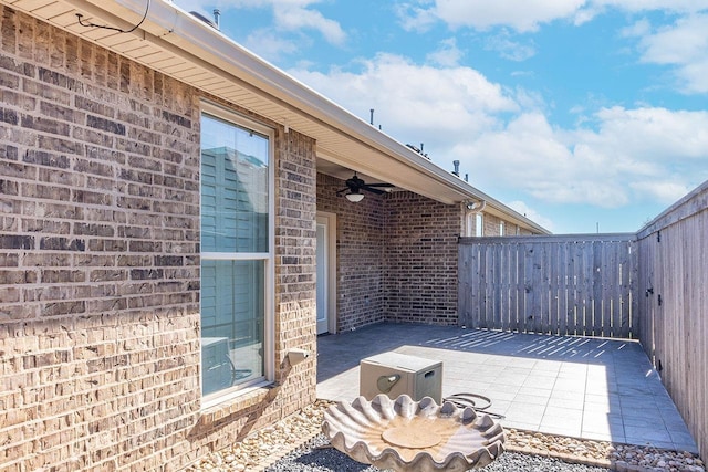 view of patio featuring ceiling fan