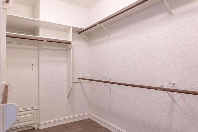 3865 E Pointe Dr, Beaumont, TX 77706 - walk in closet featuring dark wood-style flooring